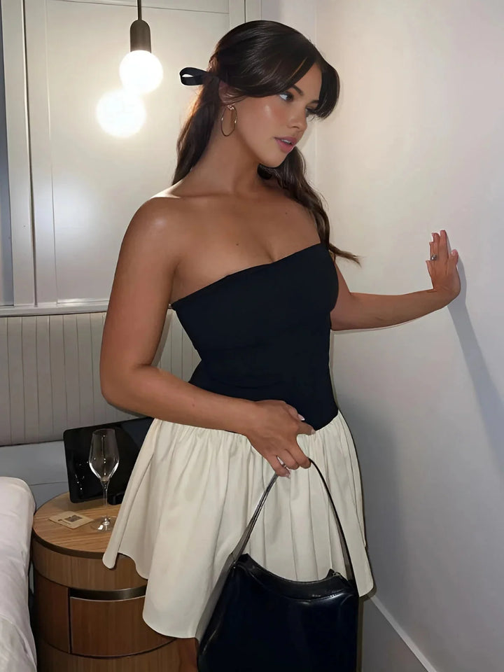 Strapless color block mini dress with a chic design in a blend of cotton and polyester fabric.