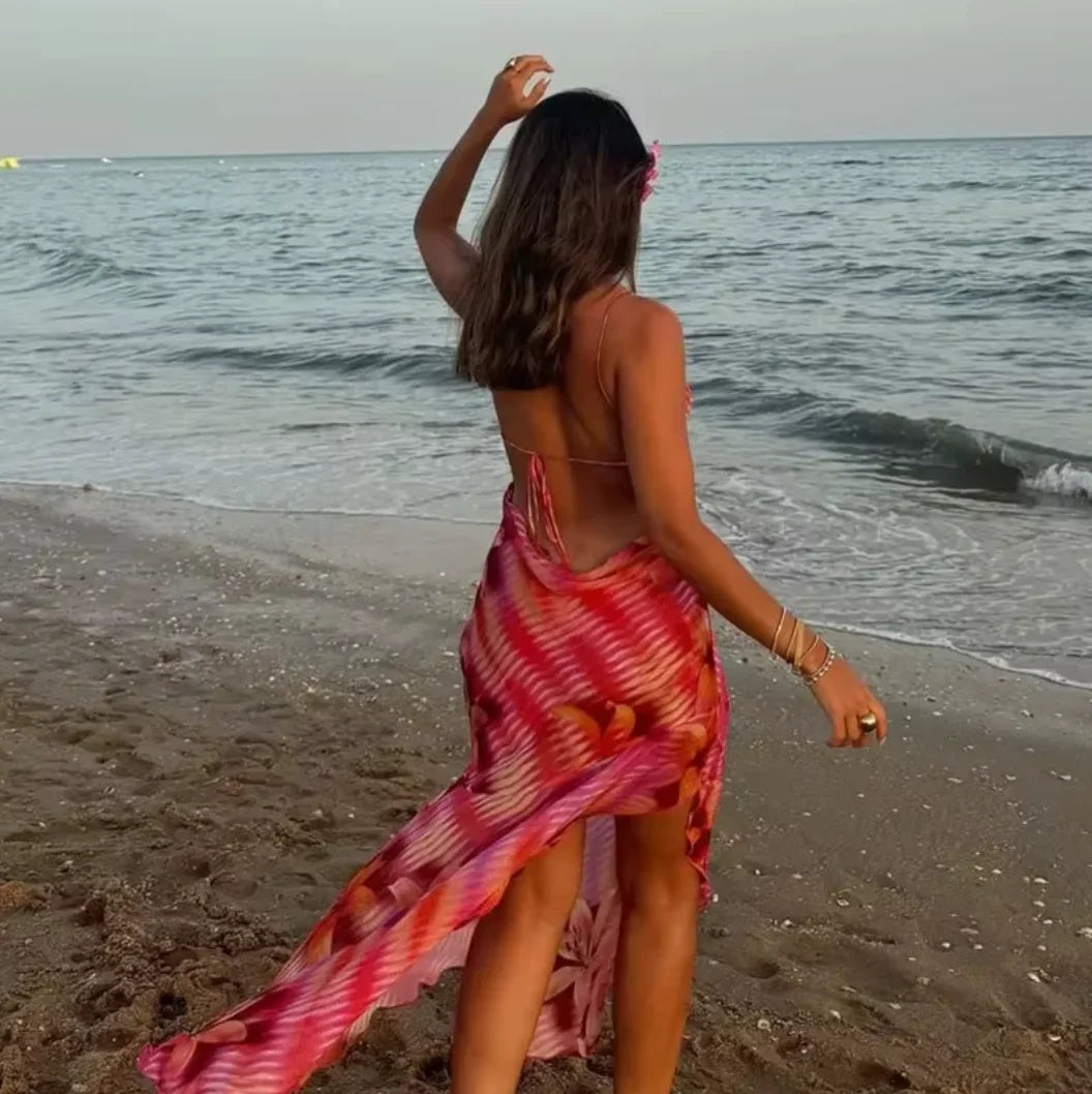 Floral print maxi dress in bold colors, perfect for the beach. Made of airy and breathable fabric, with a flowy silhouette.